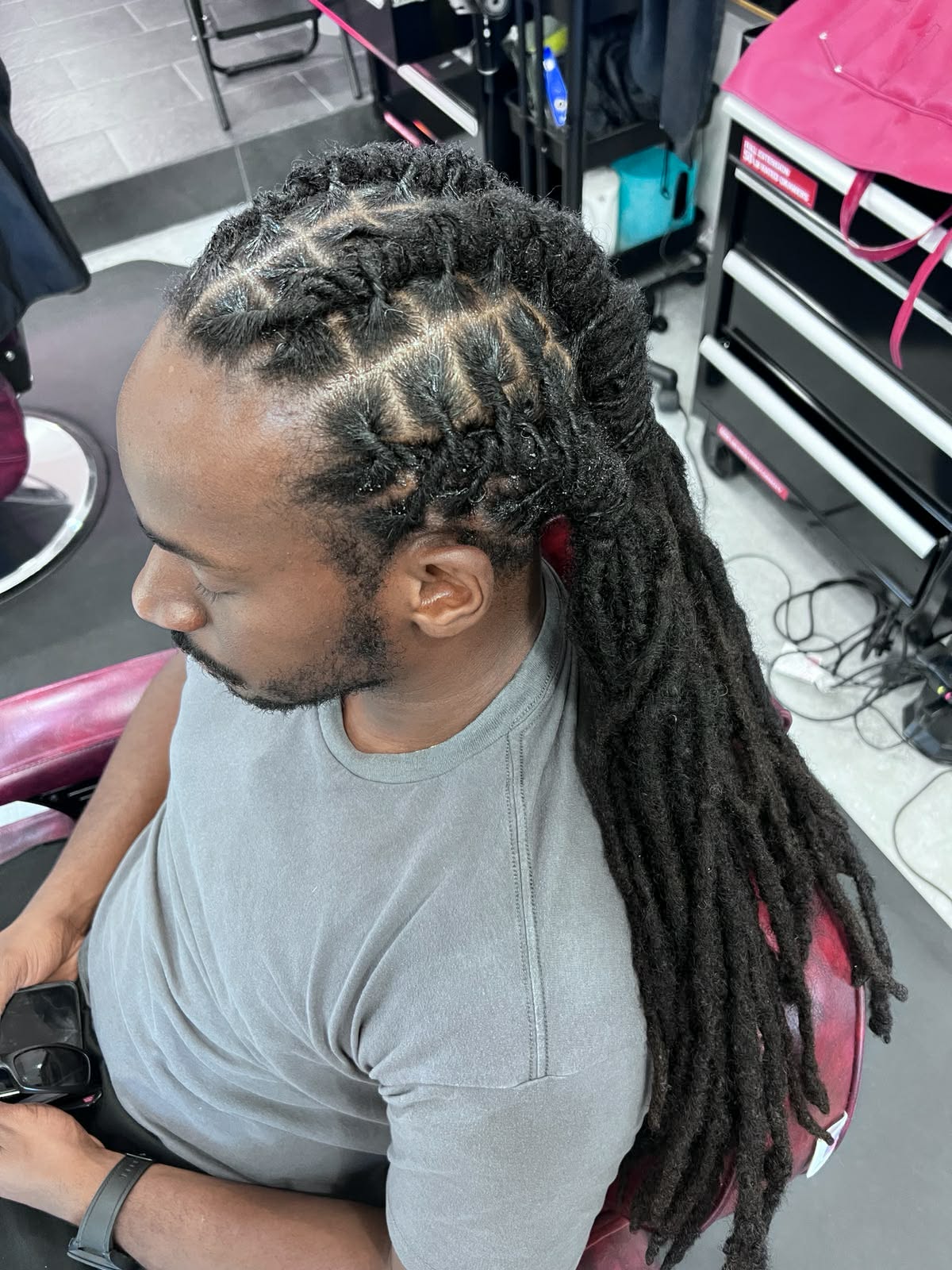 Loc retwist with a braided crown on long mature locs