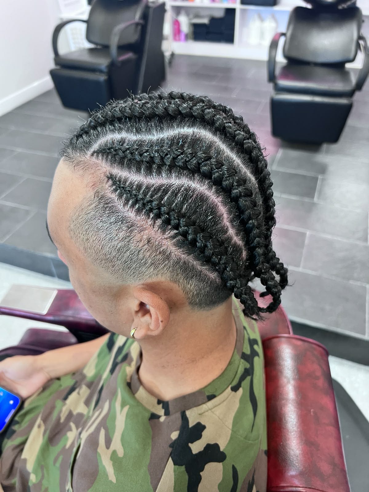 Mohawk-style cornrows with an undercut fade